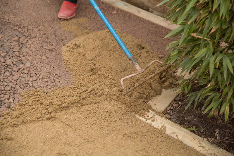filling lawn area with sand