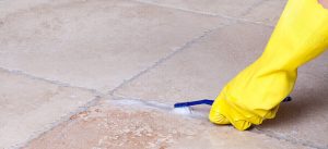 Cleaning tile grout with a toothbrush