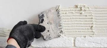 applying tile adhesive