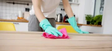 woman cleaning a kitchen