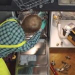 technician installing a dishwasher