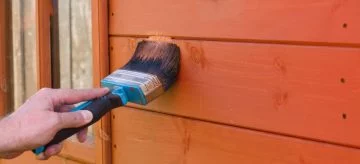 hand painting shed wall