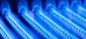 Blue flames of a gas burner inside your boiler