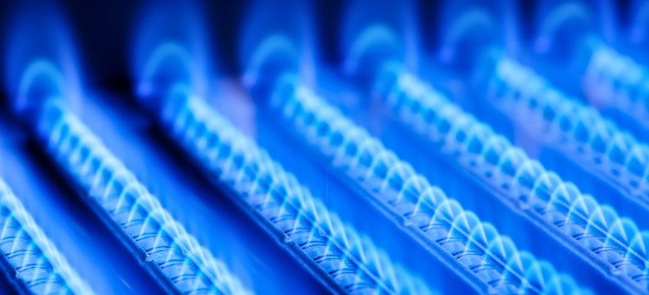 Blue flames of a gas burner inside your boiler.