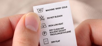 Close up of clothes label showing cleaning instructions