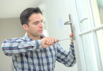 Man changing a door handle
