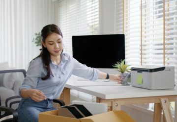 Woman preparing home office for move