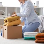 Woman going through stored clothes and items