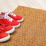 Red shoes on a coir carpet