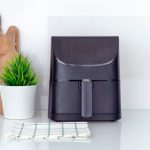 Black air fryer on the kitchen counter