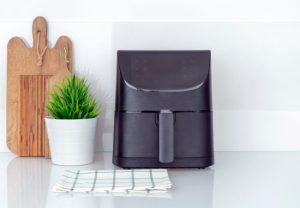 Black air fryer on the kitchen counter