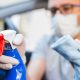 man disinfecting inside of car