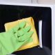 A microwave being cleaned