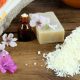 Bar of soap, essential oil and grated soap necessary for homemade eco-friendly laundry detergent.